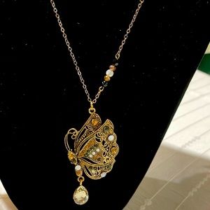 Beautiful butterfly pendant with beaded accents.